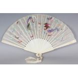 A 19TH/20TH CENTURY CHINESE EMBROIDERED SILK FAN, with ivory sticks, the silk decorated with a