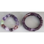 TWO AMETHYST HARDSTONE BANGLES, the largest approx. 3in diameter. (2)