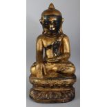 A GOOD LARGE 18TH/19TH CENTURY BURMESE GILT & LACQUERED WOOD SHAN BUDDHA, seated in meditation on