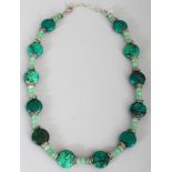 A MALACHITE &GREEN HARDSTONE NECKLACE, composed of circular and facetted beads, approx. 39in long.