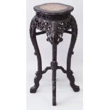 A 19TH CENTURY CHINESE MARBLE TOP CARVED HARDWOOD STAND, with a quatrefoil shaped top surface, the