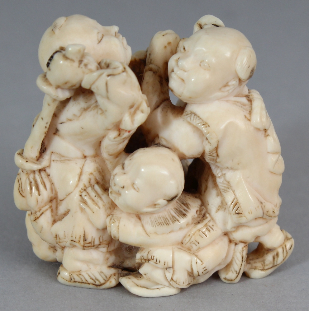 A GOOD QUALITY JAPANESE MEIJI PERIOD IVORY OKIMONO OF A GROUP OF FIVE PLAYING BOYS, unsigned, 1.