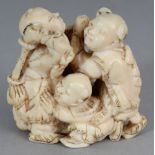 A GOOD QUALITY JAPANESE MEIJI PERIOD IVORY OKIMONO OF A GROUP OF FIVE PLAYING BOYS, unsigned, 1.