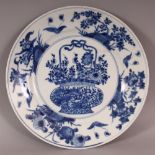 A CHINESE KANGXI PERIOD BLUE & WHITE PORCELAIN PLATE, circa 1700, painted to its centre with a