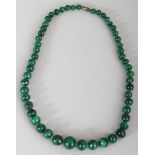 A MALACHITE HARDSTONE NECKLACE, composed of graduated spherical beads, approx. 37.5in long.