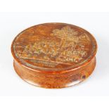 A FRENCH CIRCULAR SNUFF BOX, the cover with a scene REJOUISSANCE FLAMANDE. 8cms diameter.