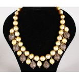 A SUPERB GOLD, SILVER, DIAMOND AND PEARL NECKLACE with diamond drops.