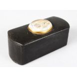 A DEEP VICTORIAN MASONIC PAPIER MACHE SNUFF BOX with oval Masonic plaque. 10cms long.