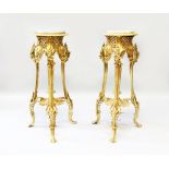 A PAIR OF ROCOCO STYLE GILT BRONZE STANDS, with variegated round marble insets (2). 2ft 6ins x 10.