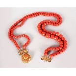 A SUPERB TWO ROW CORAL BEAD NECKLACE with gold clasp,191gms.