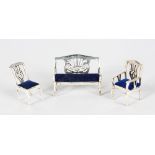 A SILVER AND BLUE VELVET SETTEE, CHAIR AND ARMCHAIR.
