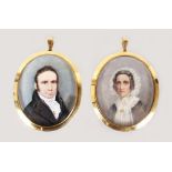 A SUPERB PAIR OF VICTORIAN OVAL PORTRAIT MINIATURES of a man in dark coat and cravat, a woman in a
