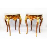 A PAIR OF LOUIS XVI STYLE MAHOGANY, ORMOLU AND INLAID TABLES, shaped tops, supported on cabriole