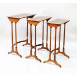 A GOOD NEST OF THREE REGENCY MAHOGANY TABLES with plain rectangular tops and turned supports.
