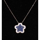 AN 18CT WHITE GOLD, SAPPHIRE AND DIAMOND NECKLACE in the form of a five leaf clover.