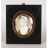 AN EARLY 19TH CENTURY OVAL PORTRAIT MINIATURE OF AN OLD LADY wearing a large bonnet. 8cms x 5.5cms