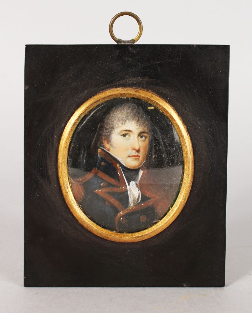 A 19TH CENTURY OVAL PORTRAIT MINIATURE OF A MAN IN MILITARY DRESS. 7cms x 6cms, with gilt surround