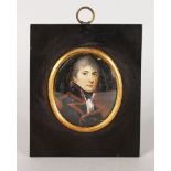 A 19TH CENTURY OVAL PORTRAIT MINIATURE OF A MAN IN MILITARY DRESS. 7cms x 6cms, with gilt surround