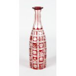 A BOHEMIAN RUBY CARAFE with engraved panels. 11ins high.