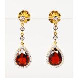A GOOD PAIR OF 18CT YELLOW GOLD PEAR SHAPED GARNET AND DIAMOND EARRINGS.