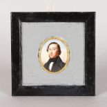 A 19TH CENTURY OVAL PORTRAIT MINIATURE OF A MAN wearing a dark coat and cravat. 4cms x 3.5cms,