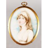 A LATE 19TH CENTURY-EARLY 20TH CENTURY OVAL PORTRAIT MINIATURE OF A YOUNG LADY with long flowing