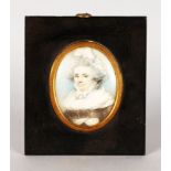 AN OVAL PORTRAIT MINIATURE OF OLD MRS FENWICK wearing a large lace bonnet. 8cms x 6.5cms, with metal