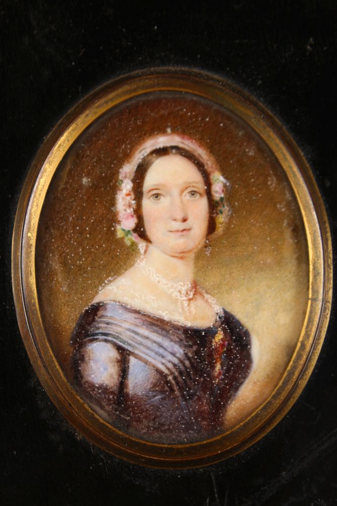 A VICTORIAN OVAL PORTRAIT MINIATURE OF A LADY in a blue dress with lace bonnet. 5.5cms x 4.5cms with - Image 2 of 2