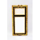 A GILT MIRROR with a panel of cupids. 1ft 9ins long.