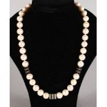 A STRING OF 38 PEARLS with diamond and enamel sections.
