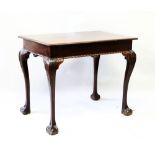 A GEORGIAN IRISH RED WALNUT RECTANGULAR TOP TABLE, with plain top, carved frieze with cabriole