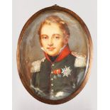 A 19TH CENTURY OVAL PORTRAIT MINIATURE OF A NAVAL OFFICER. 8cms x 6cms in a metal frame.