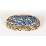 A CHINESE FILIGREE SILVER AND CARVED LAPIS BROOCH.