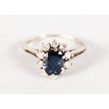 A GOOD 18CT WHITE GOLD, SAPPHIRE AND DIAMOND CLUSTER RING.