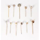 A SELECTION OF ELEVEN TIE PINS.