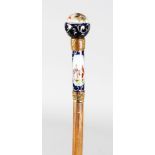 A FRENCH WALKING CANE with blue enamel handle. 3ft long.