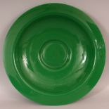 A LARGE 19TH/20TH CENTURY CHINESE APPLE GREEN BEIJING GLASS DISH, of shallow form and with a flanged