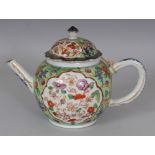 AN 18TH CENTURY CHINESE CLOBBERED PORCELAIN TEAPOT & COVER, with a few loose sprays in underglaze-