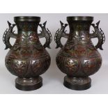 A LARGE PAIR OF JAPANESE MEIJI PERIOD CHAMPLEVE BRONZE VASES, each decorated with formal designs,