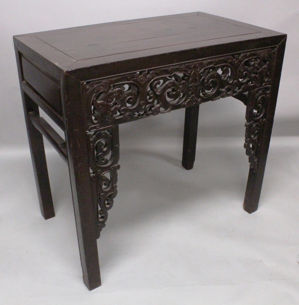 A GOOD 19TH CENTURY CHINESE RECTANGULAR HARDWOOD ALTER TABLE, the pierced frieze carved with