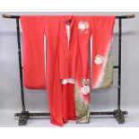 TWO LARGE JAPANESE MEIJI PERIOD LACQUERED WOOD SECTIONAL KIMONO STANDS, one lacking stabilising