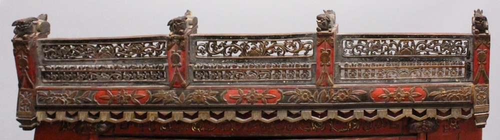 ANOTHER LARGE EARLY 20TH CENTURY CHINESE RED GROUND LACQUERED WOOD CABINET, with an elaborately - Image 3 of 7