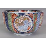 A LARGE JAPANESE IMARI FUKAGAWA STYLE DEEP PORCELAIN BOWL, painted to the interior and exterior