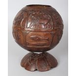 AN UNUSUAL 19TH/20TH CENTURY EASTERN COCONUT ZODIAC CUP & STAND, the sides carved with Zodiac