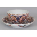 AN EARLY 18TH CENTURY JAPANESE IMARI PORCELAIN TEABOWL & SAUCER, of larger than average size, each