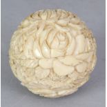 A JAPANESE MEIJI PERIOD BALL-FORM IVORY BOX, with a screw action cover, the spherical form carved in