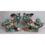 A LARGE PAIR OF EARLY 20TH CENTURY CHINESE SHIWAN GLAZED STONEWARE MODELS OF BUDDHISTIC LIONS, one