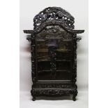 A LARGE 19TH/20TH CENTURY CHINESE CARVED WOOD DISPLAY CABINET, with large glass panel door enclosing