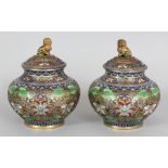 A PAIR OF GOOD QUALITY 20TH CENTURY CHINESE CLOISONNE VASES & COVERS, each decorated with formal