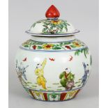 A CHINESE DOUCAI PORCELAIN JAR & COVER, the sides decorated with a continuous scene of boys